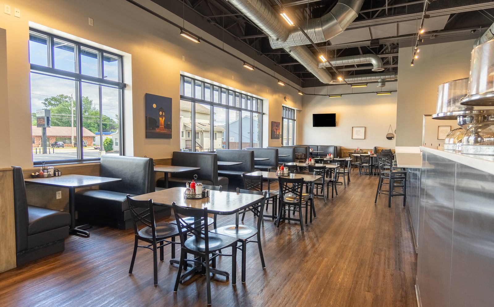 Honeymoon Grille dining area with booths and large windows