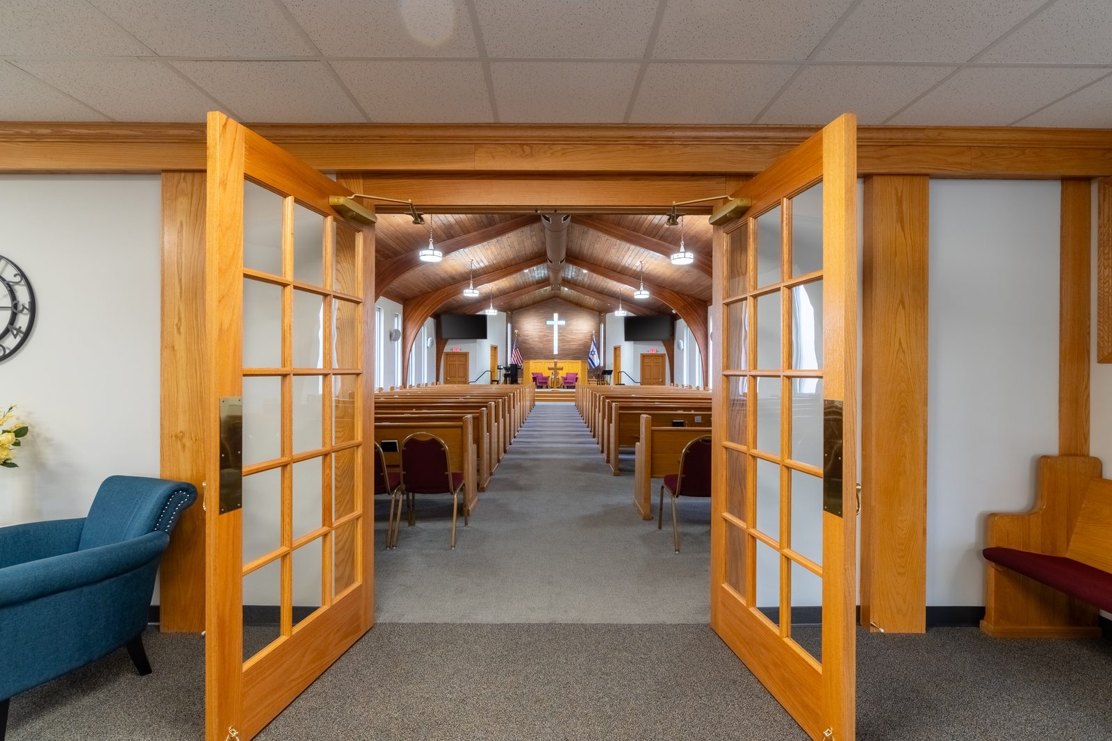 Greentown Baptist Church sanctuary entrance with pews and cross