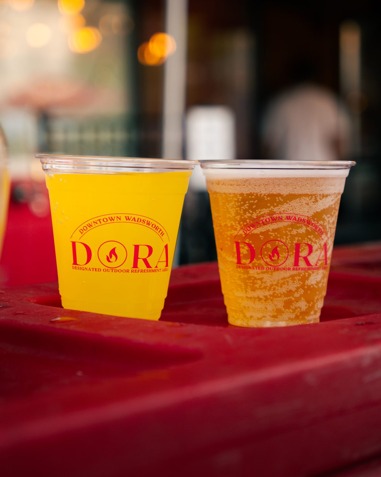 Two drink cups branded for Downtown Wadsworth's DORA district